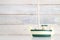 Small white and green wooden boat model
