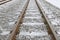 Small white ice crystals forming on railway train tracks during