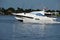 Small white motor yacht on the Florida Intra-Coastal Waterway