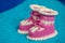 Small white-pink children& x27;s knitted booties