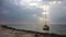 A small white sea yacht moored near the Black Sea shoreline