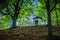 Small white structure in a beautiful forest. Calvary over Kremnica town in Slovakia.