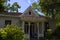 A small, white Victorian porch