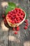 Small wicker basket with fresh ripe raspberries