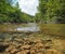 Small wild river with rocks underwater Spain