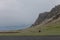 Small willage few houses on a stony rocky mountain landscape of Iceland