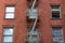 Small Window Fire Escape on a Brick Building in Tribeca New York