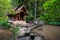 Small wood church thai style at kantrapruksa temple in Mae Kampong , surround by waterfall and evergreen foreste in Maekampong