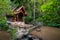 Small wood church thai style at kantrapruksa temple in Mae Kampong , surround by waterfall and evergreen foreste in Maekampong