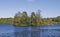 A small wooded Island with an old abandoned remains of a fortified House on but hidden by Trees, in the Loch of Clunie