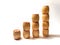 Small wooden barrels with numbers built in columns. The concept of progressive movement in achieving the goal. The
