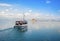 Small wooden boat transfer a group of tourists to Bourtzi island. Nafplion , Greece