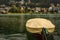 Small wooden boat under yellow tarpaulin on mountain lake, St. M