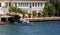 Small wooden boats in Bosphorus, residential house, Istanbul,Turkey.