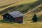 Small wooden cabin on grassland, in seiser alm