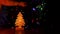 Small wooden Christmas tree with glowing lights