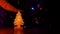 Small wooden Christmas tree with glowing lights