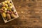 Small wooden crate filled with fresh potatoes