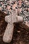 Small Wooden Cross on Gravestone