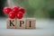 Small wooden cube block with alphabets building the word KPI