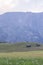 Small wooden farm house, cottage or log cabins on meadow on Alpe di Siusi, Seiser Alm, South Tyrol, Italy