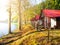 Small wooden forest cottages at the water