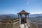 Small wooden gazebo high in the mountains.