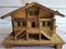 Small wooden house, handmade, with many details, front view,