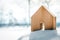 Small wooden House standing in the snow, planning Housebuilding on the building area