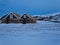 Small wooden houses with a thick wall of peat