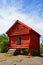 Small wooden red house