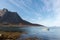 Small wooden rowboat moored in a Tromso fjord