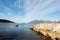 Small wooden rowboat moored in a Tromso fjord