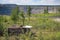 Small wooden shelter at the edge of open mine