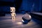 Small wooden toy robot in the dark