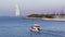 Small yacht moving alone the sea with Burj Al Arab hotel seen on background on February 12,2017.