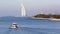 Small yacht moving alone the sea with Burj Al Arab hotel seen on background on February 12,2017.