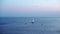 A small yacht sails in the Gulf of Finland during the white nights of St. Petersburg