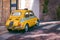 Small yellow classic Italian Retro taxi funny car, travel, tour and tourism, Italy