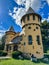 Small yellow Curwood Castle in Owosso, Michigan