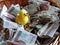 A small yellow cypher in a basket with paper money. Money does not peck the chickens. Polish paper banknotes. Donations for those