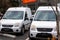 A Smalll Fleet of Miniature, White  Delivery Vans used in Small Business