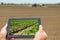 Smart agriculture. Farmer using tablet Soy planting. Modern Agriculture concept.