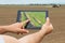 Smart agriculture. Farmer using tablet Soy planting. Modern Agriculture concept.