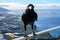 Smart Black Canary Crow or Raven bird, not afraid of people, sitting on beautiful viewpoint on La Palma island, Canary islands,