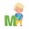 Smart Boy Pupil Holding ABC Book and Standing Near Big Alphabet Letter M Vector Illustration