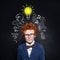 Smart child in school uniform and lightbulb, brainstorming and idea concept
