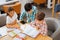 Smart children studying foreign languages in a classroom