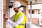 Smart civil architect engineer inspecting indoor construction building site