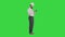 Smart engineer in white shirt and safety engineering hat using smartphone on a Green Screen, Chroma Key.